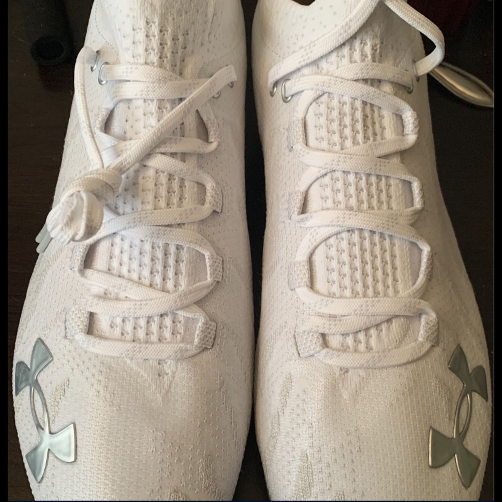 Under armor all white cleats. Never been worn before, size 12